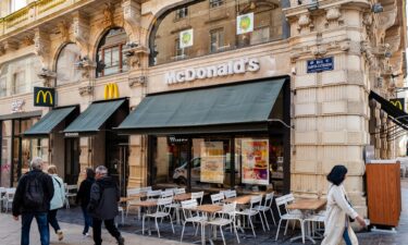 Customers stand in line at a Tasty Crousty fast food restaurant in Paris. The chain