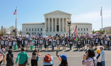 President Donald Trump rides in his motorcade as he arrives at the Supreme Court.