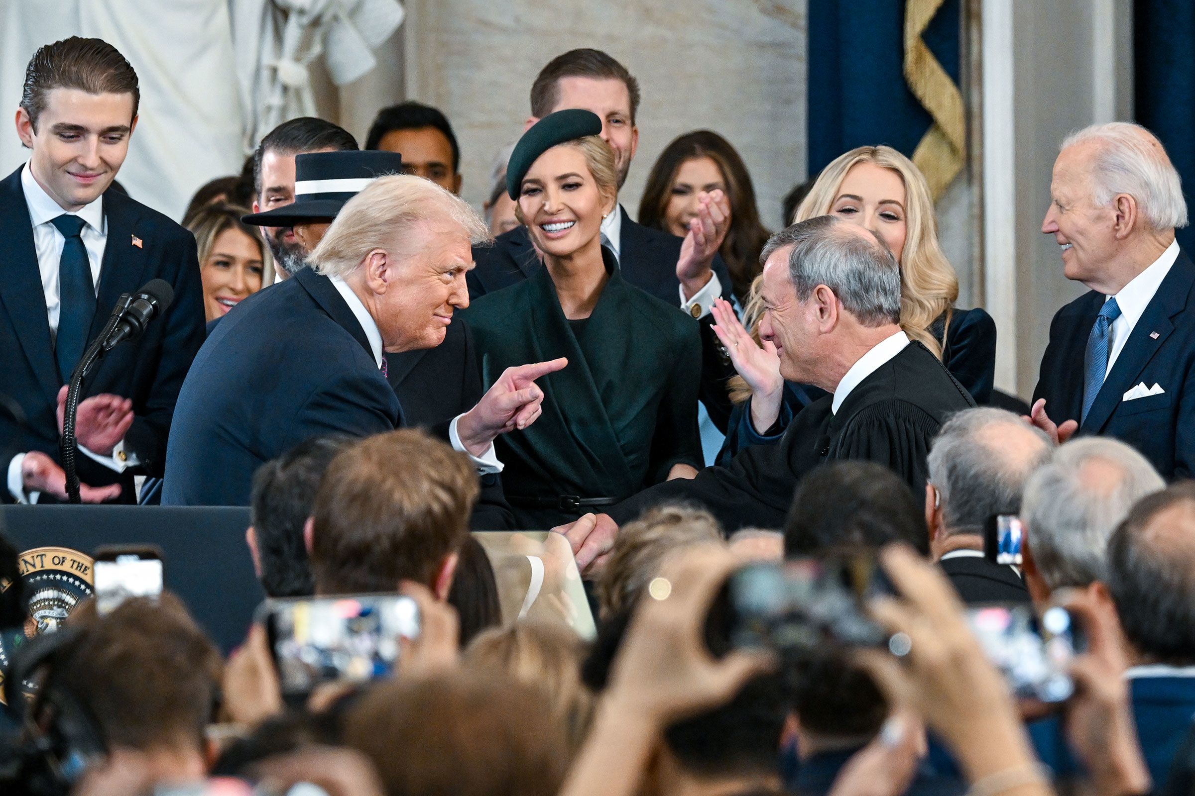 <i>Kenny Holston/Pool/Getty Images/File via CNN Newsource</i><br/>President Donald Trump gestures to Supreme Court Chief Justice John Roberts after being sworn in at his inauguration in the US Capitol Rotunda on January 20