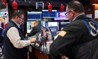 Traders work on the floor of the New York Stock Exchange during morning trading on Thursday.