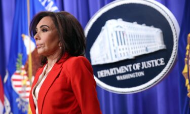National Guard soldiers from Alabama look at a makeshift memorial honoring West Virginia National Guard soldier Sarah Beckstrom