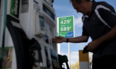 Carlos Ferre fuels up at a gas station on April 6 in Miami