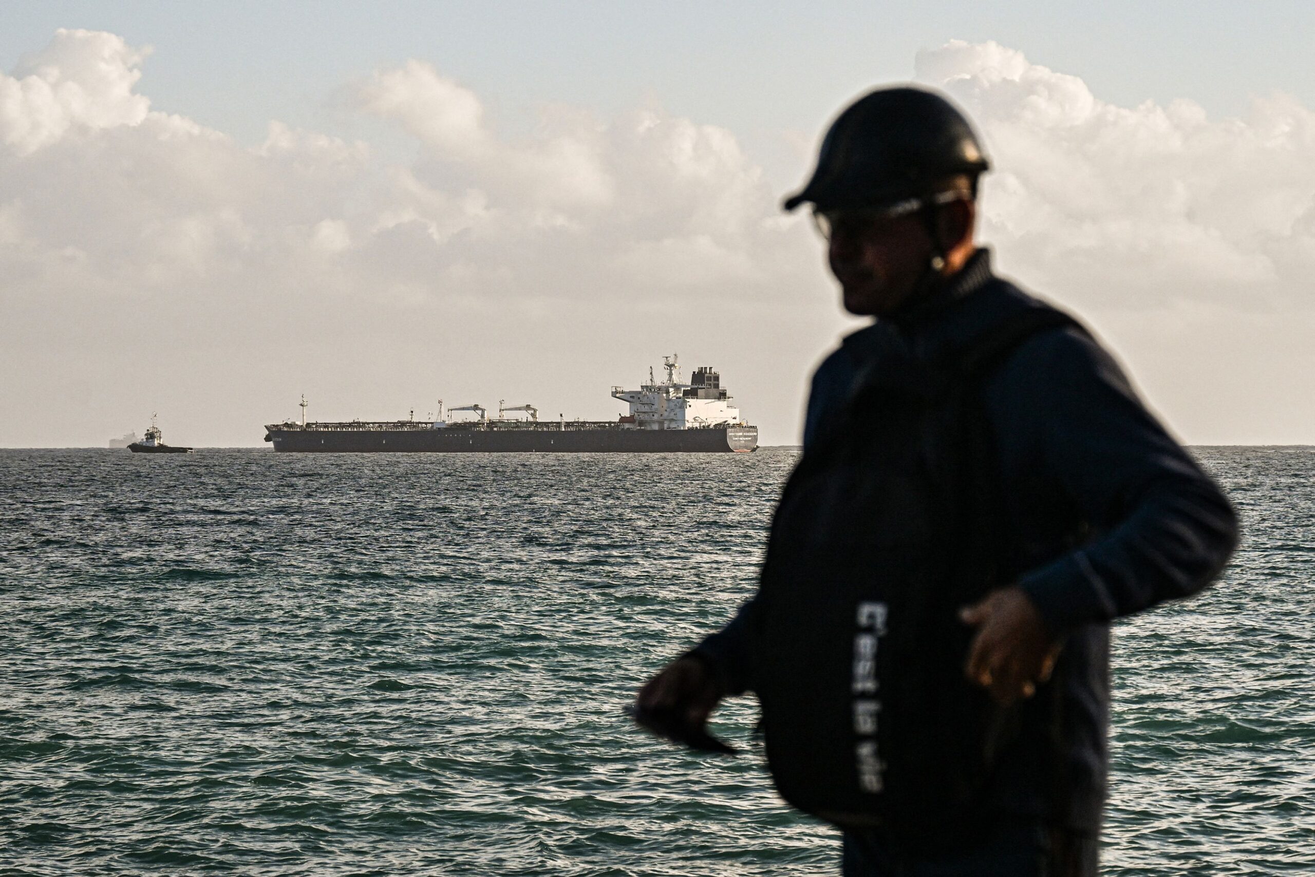 <i>Yamil Lage/AFP/Getty Images via CNN Newsource</i><br/>A tugboat guides a Russian oil tanker at a terminal in northwestern Cuba on March 31