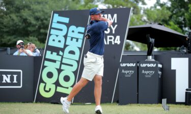 Dustin Johnson reads a green during a LIV Golf event in Illinois in 2023.