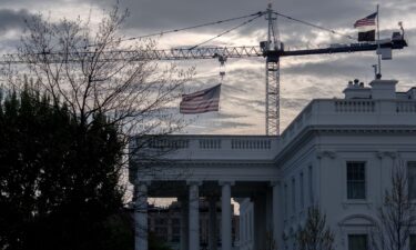 A crane being used to construct the new White House ballroom is seen next to the White House