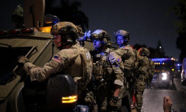 FBI agents leave a California residence associated with Cole Allen