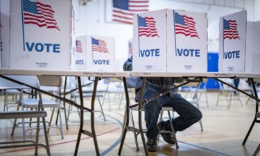 People cast their votes at the Bailey's Elementary School polling location in Falls Church