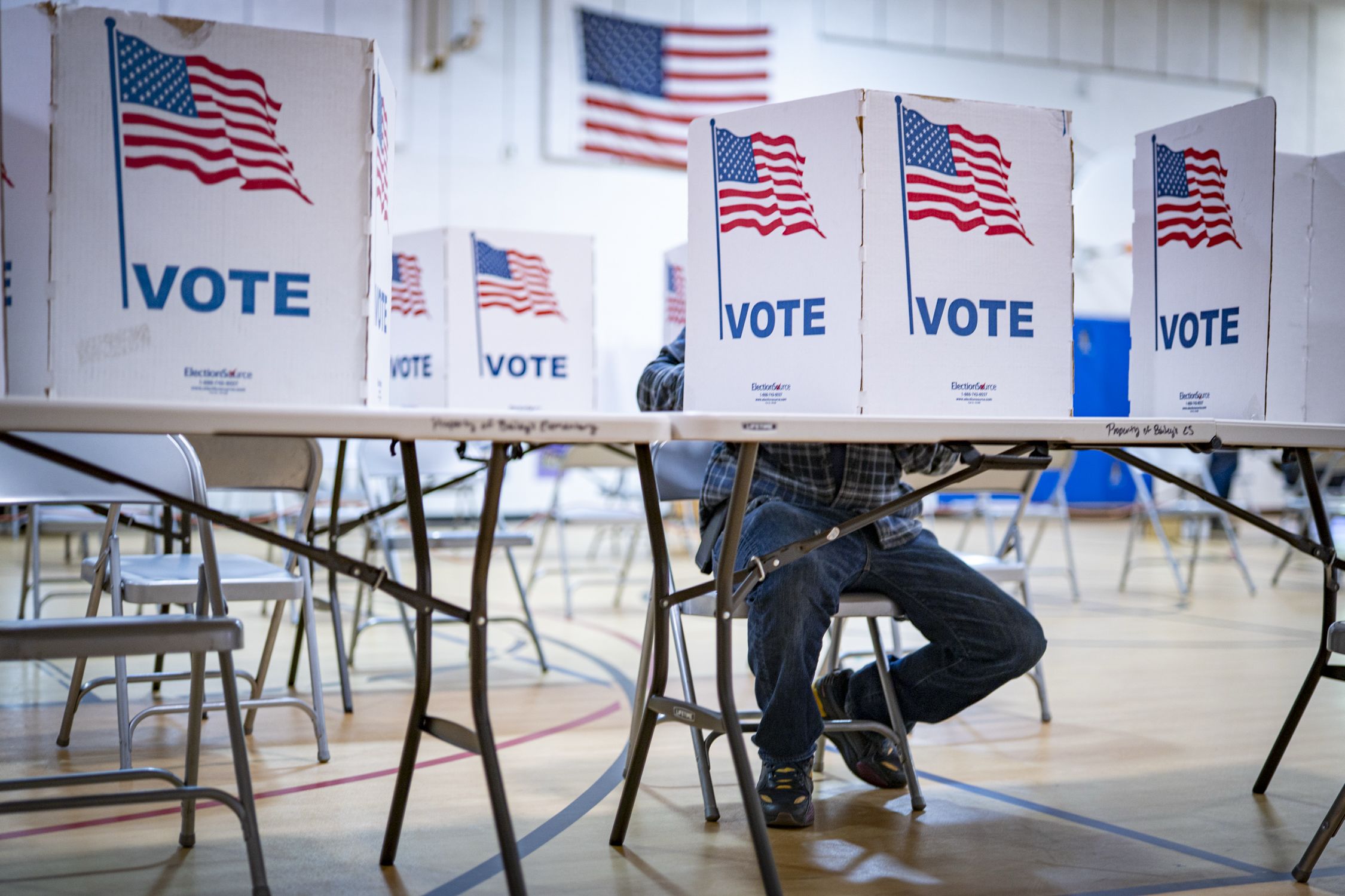 <i>Maxine Wallace/The Washington/Getty Images via CNN Newsource</i><br/>People cast their votes at the Bailey's Elementary School polling location in Falls Church