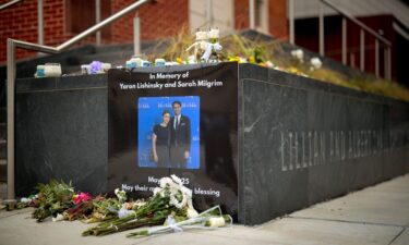 A photograph of Sarah Lynn Milgrim and Yaron Lischinsky is displayed outside the Lillian and Albert Small Capital Jewish Museum on May 29