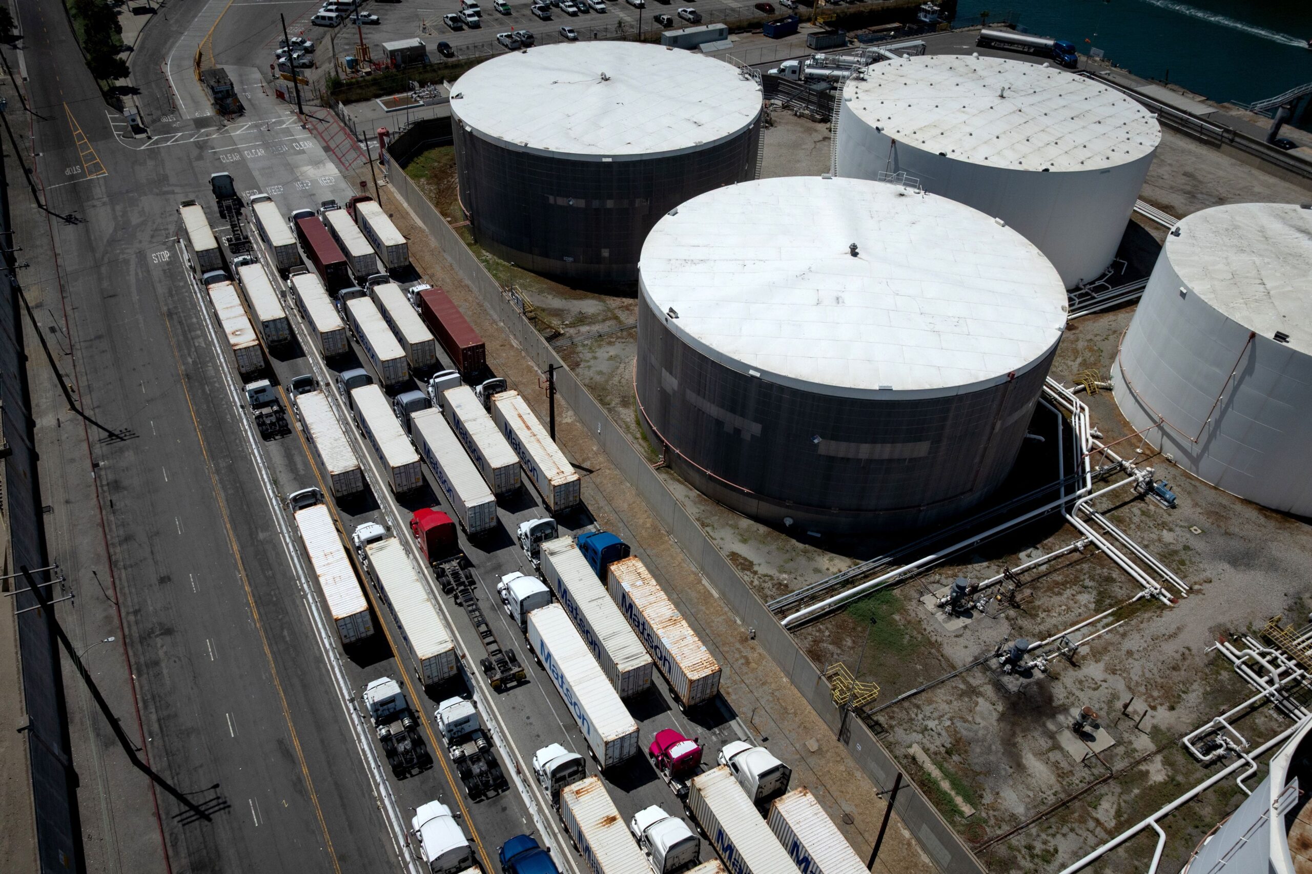 <i>Eric Thayer/Los Angeles Times/Getty Images via CNN Newsource</i><br/>Trucks and tanks at the Port of Long Beach on Wednesday