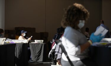 Election workers count Fulton County ballots at State Farm Arena on November 4