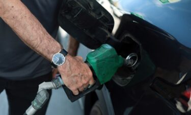 A person fuels his vehicle at a gas station on April 6 in Miami.