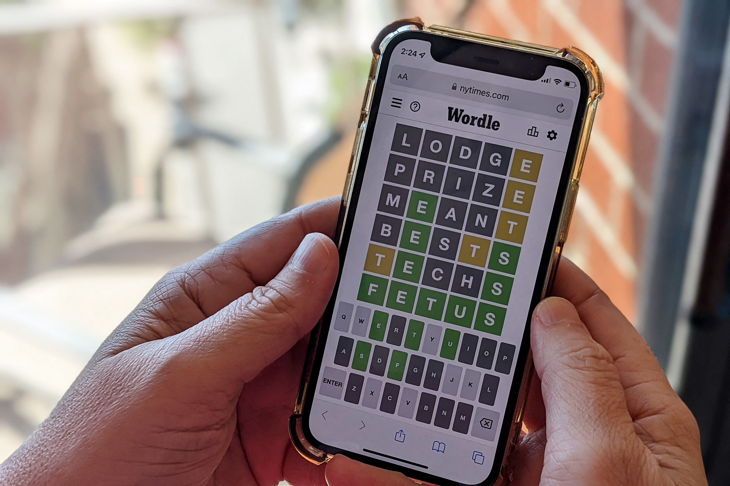 <i>Michael Draper/AFP/Getty Images via CNN Newsource</i><br/>A person plays "Wordle" on a smartphone. NBC has just ordered a game-show version of the New York Times-owned mobile word game