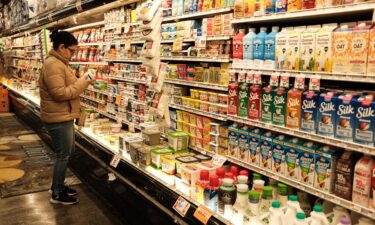 A woman shops for dairy products at a local supermarket in New York City on April 9.