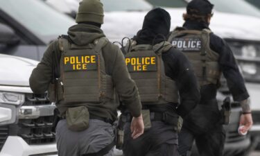 ICE agents depart the Bishop Henry Whipple Federal Building on February 4