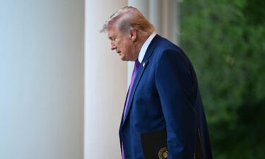 President Donald Trump arrives for a "Rose Garden Club" dinner at the White House in Washington