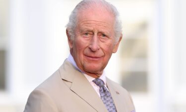 King Charles III speaks during a reception in the garden of Government House in Hamilton