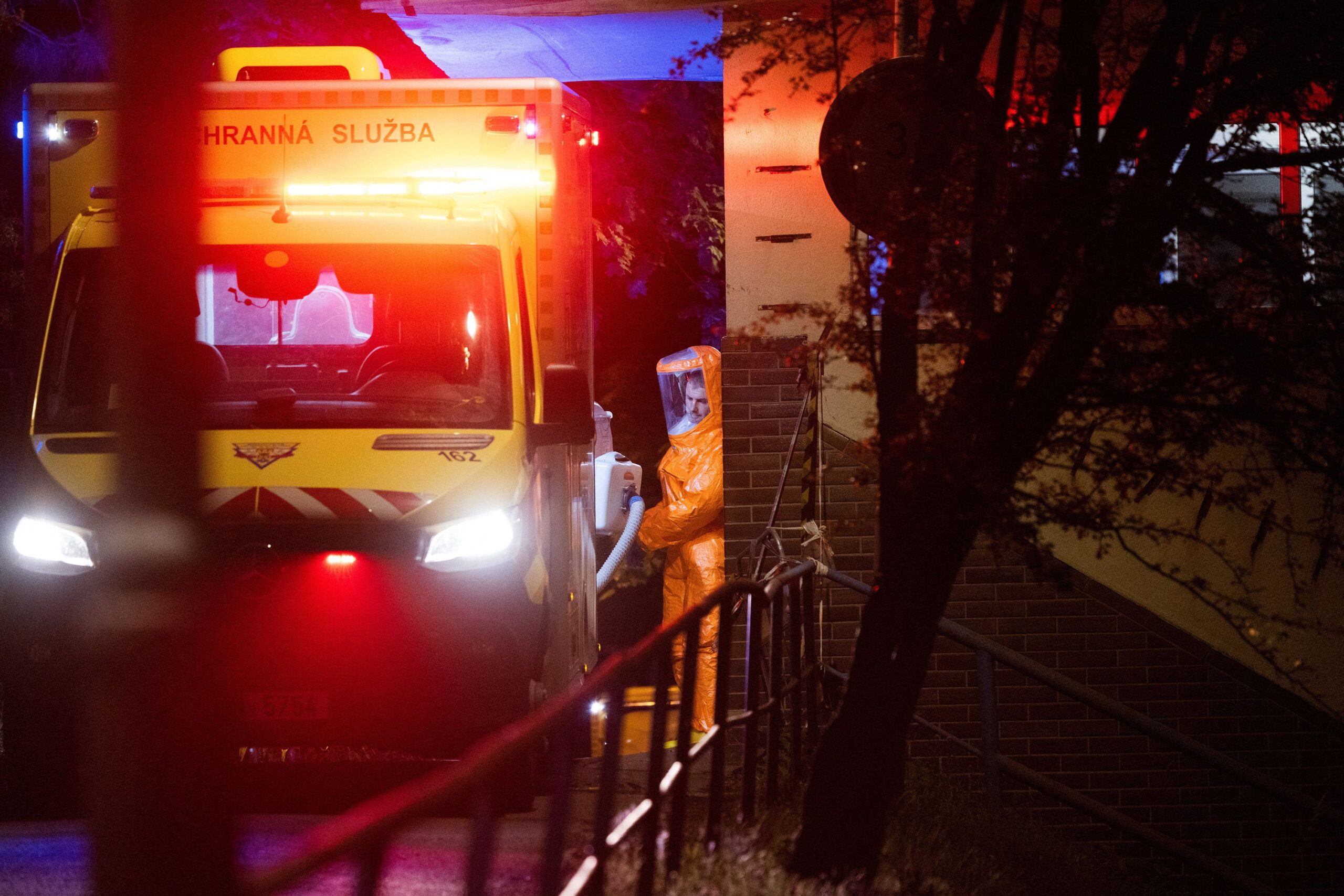 A health worker prepares to transport a patient after an ambulance, believed to be carrying a US doctor transferred from Africa, arrived at the hospital in Prague, Czech Republic.