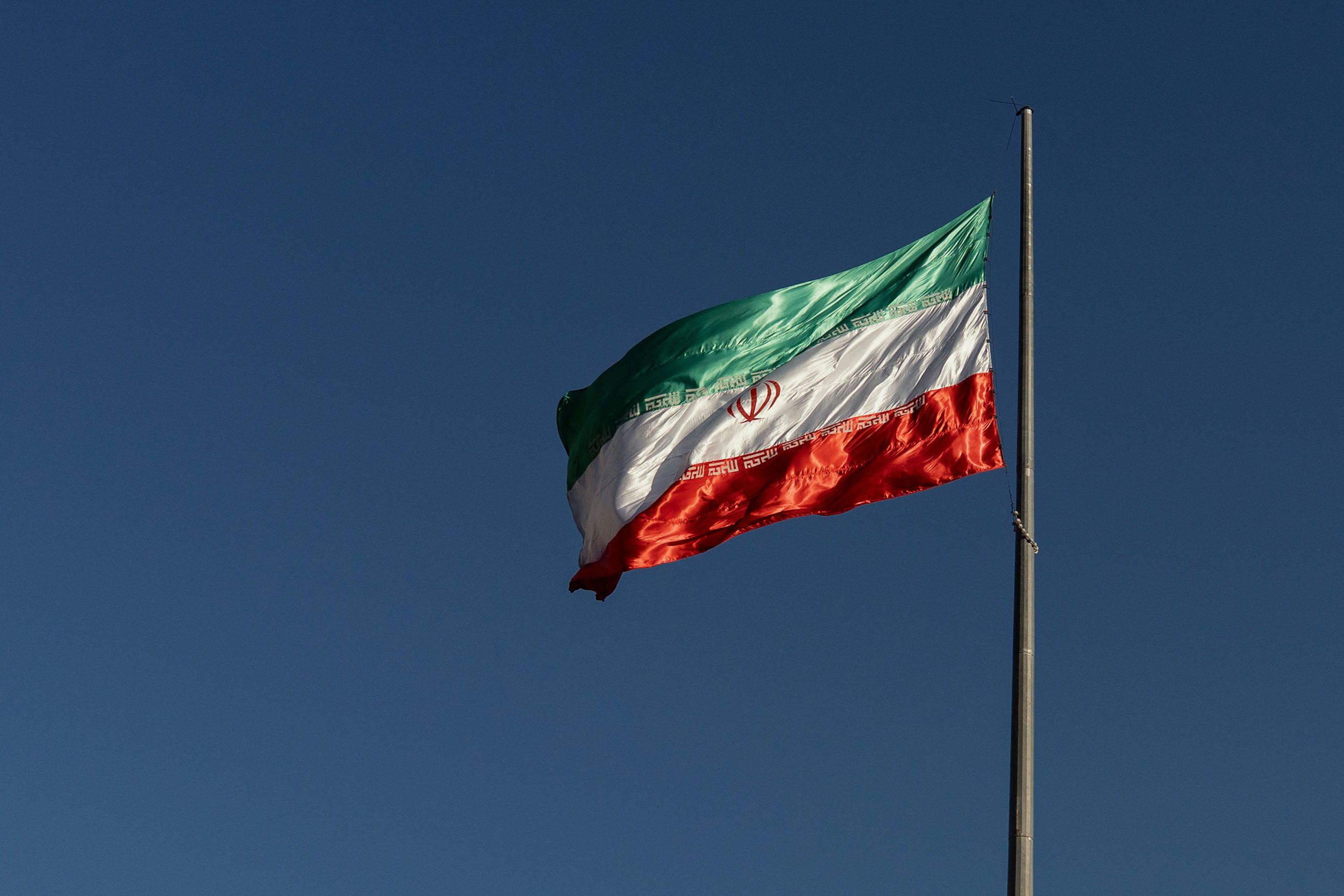 <i>Bahram/Middle East Images/AFP/Getty Images via CNN Newsource</i><br/>The Iranian national flag flies atop a pole at Bam-e Tehran in Tehran