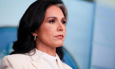 Director of National Intelligence Tulsi Gabbard looks on during a press briefing at the White House on July 23