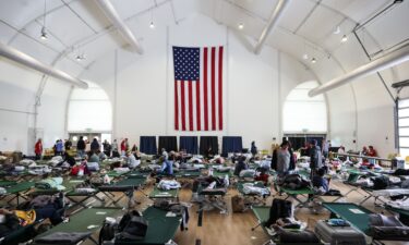 People gather outside a shelter for evacuees in Fountain Valley