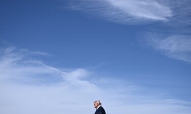President Donald Trump walks as he arrives at Morristown Airport in New Jersey