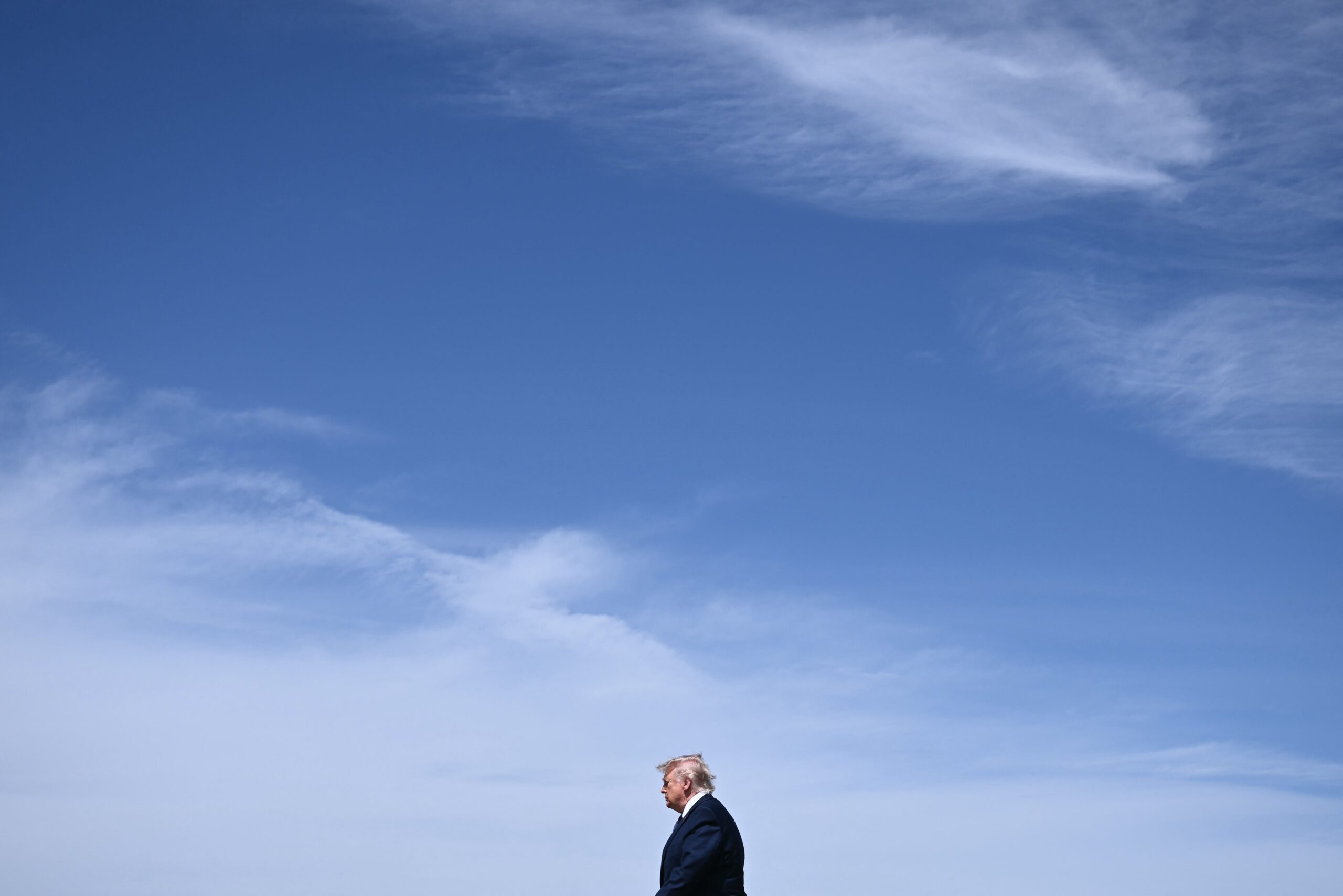 <i>Brendan Smialowski/AFP/Getty Images via CNN Newsource</i><br/>President Donald Trump walks as he arrives at Morristown Airport in New Jersey