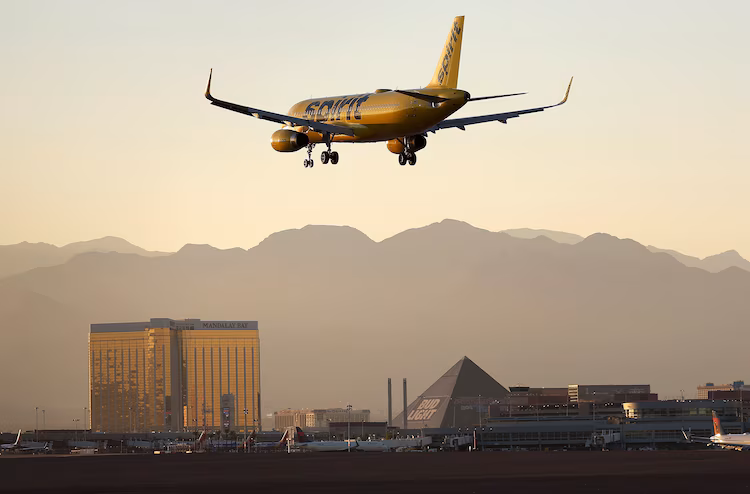 A Spirit Airlines plane lands at Harry Reid International Airport on October 14, 2022 in Las Vegas, Nevada.