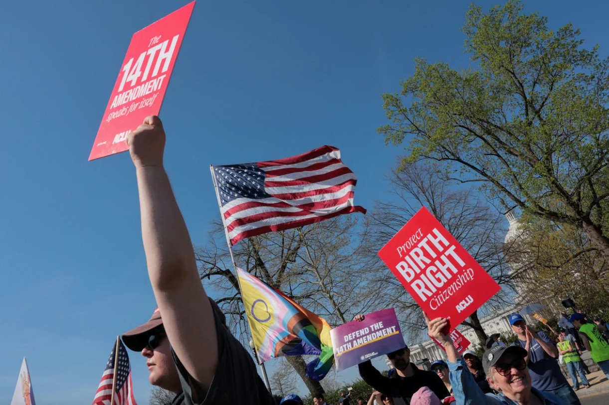 <i>Kylie Cooper/Reuters via CNN Newsource</i><br/>Demonstrators hold placards near the Supreme Court building in Washington