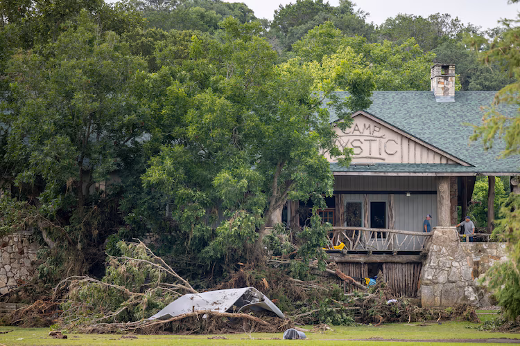 Debris is piled up at the entrance to Camp Mystic on July 07, 2025 in Hunt, Texas.