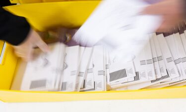 Election workers sort ballots at Contra Costa County's election operations facility on May 27 in Martinez