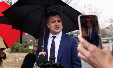 A reporter films with her phone as U.S. Federal Housing Finance Agency Director Bill Pulte speaks at the White House in Washington