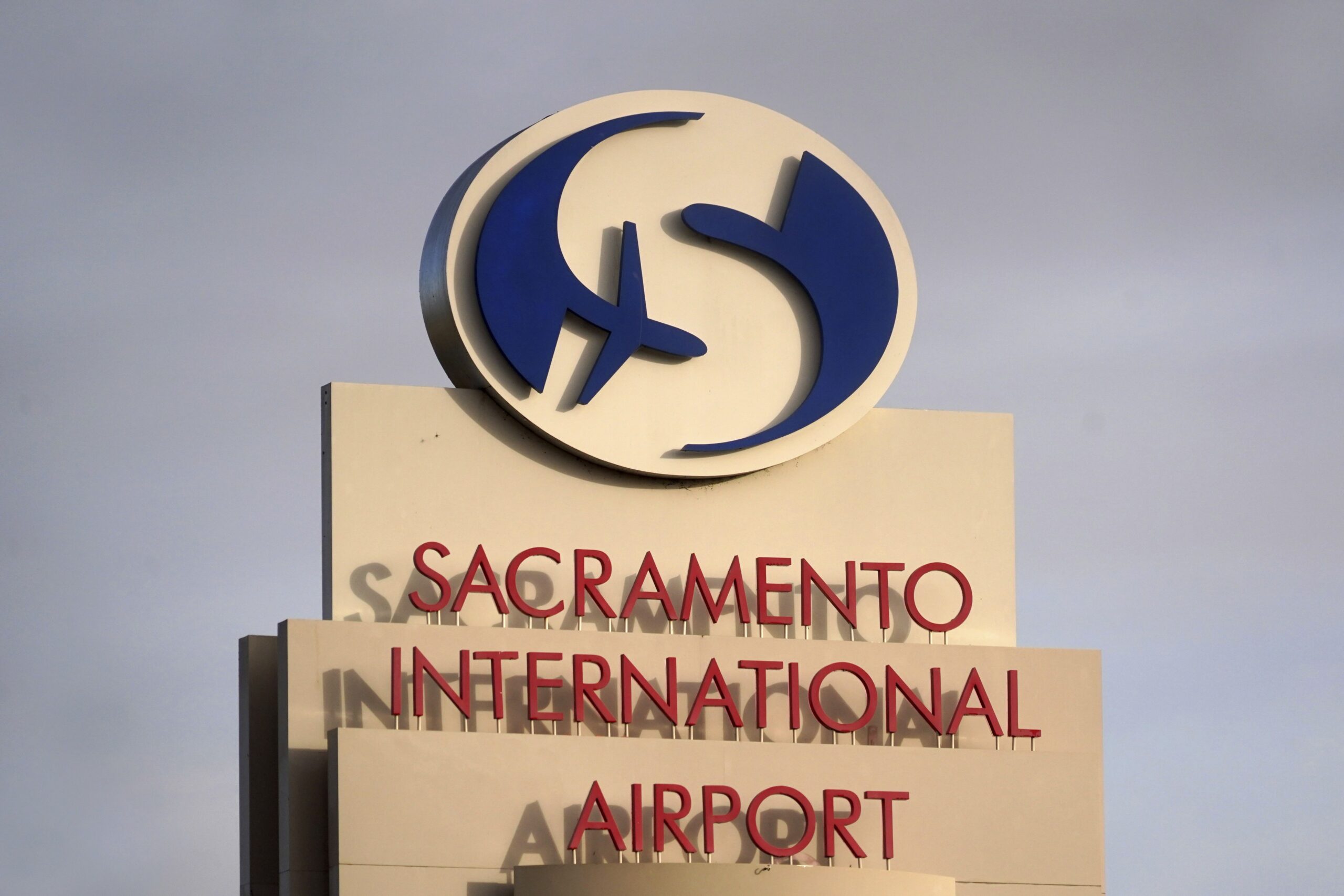 <i>Kirby Lee/AP via CNN Newsource</i><br/>A sign at the entrance to the Sacramento International Airport