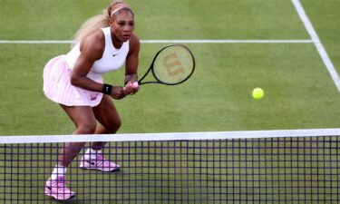 Serena Williams serves in front of a packed house at the Queen's Club in west London.