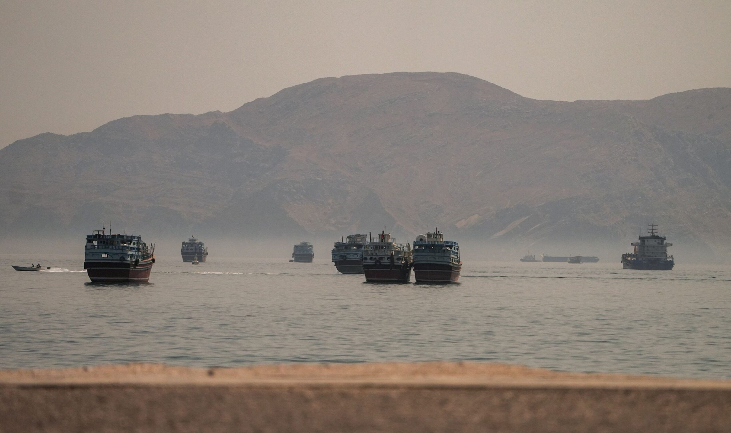 Vessels are anchored in the Strait of Hormuz, as seen from Musandam, Oman, on June 19.