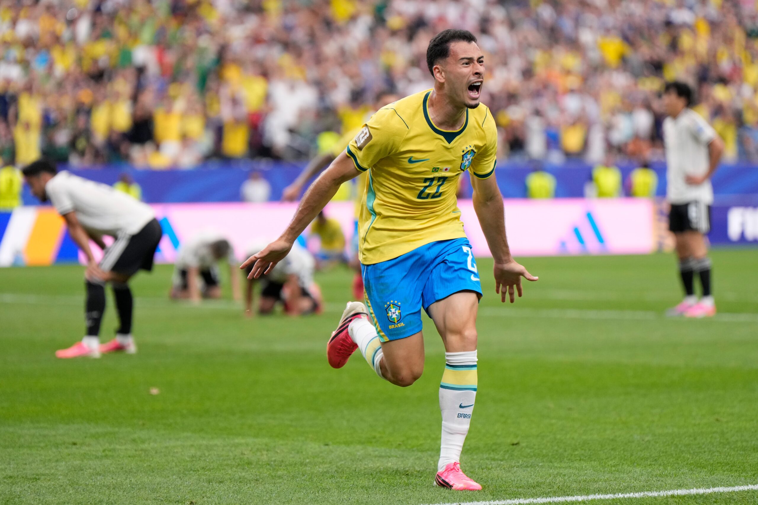 <i>Ashley Landis/AP via CNN Newsource</i><br/>Brazil's Gabriel Martinelli celebrates after scoring late in second-half stoppage time.