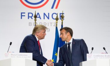 President Donald Trump and French President Emmanuel Macron shake hands during a joint press conference in Biarritz