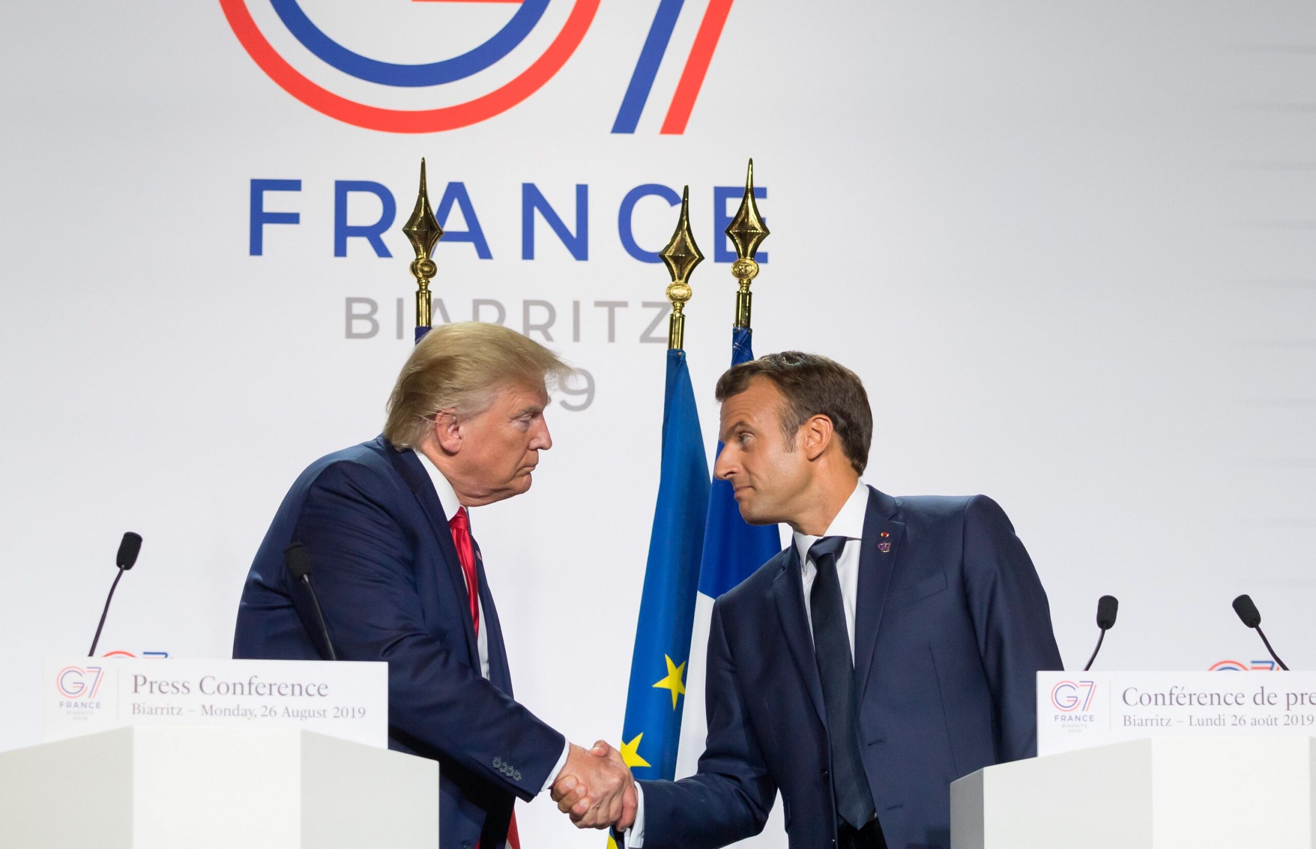 <i>Jacques Witt/SIPA/AP/File via CNN Newsource</i><br/>President Donald Trump and French President Emmanuel Macron shake hands during a joint press conference in Biarritz