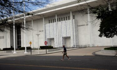 The wall of the John F. Kennedy Center for the Performing Arts is covered in tarp after President Donald Trump's name was removed