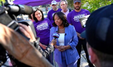 DC Mayoral candidate Janeese Lewis George gives an interview with members of the news media next to a voting site at the Chevy Chase Community Center during DC’s primary voting day in Washington