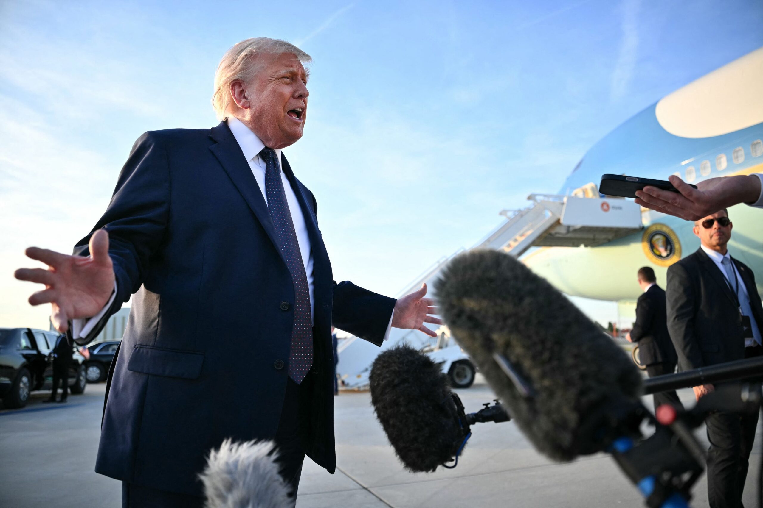 <i>Mandel Ngan/AFP/Getty Images via CNN Newsource</i><br/>US President Donald Trump addresses the media on the tarmac after arriving at Paris Orly Airport enroute to a dinner to celebrate the 250th anniversary of the independence of the United States
