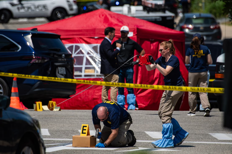 FBI agents work at a scene of a shooting involving U.S. Immigration and Customs Enforcement in Biddeford, Maine, July 13, 2026.