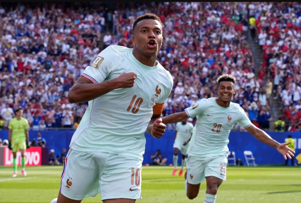 <i>Mike Segar/Reuters via CNN Newsource</i><br/>France's Ousmane Dembele checks on teammate Kylian Mbappe.