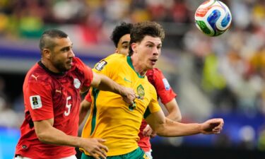 Egypt's Emam Ashour celebrates scoring the opening goal during a World Cup round of 32 soccer match between Australia and Egypt.