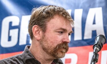 Democratic candidate for US Senate Graham Platner speaks to voters during a town hall in Portland