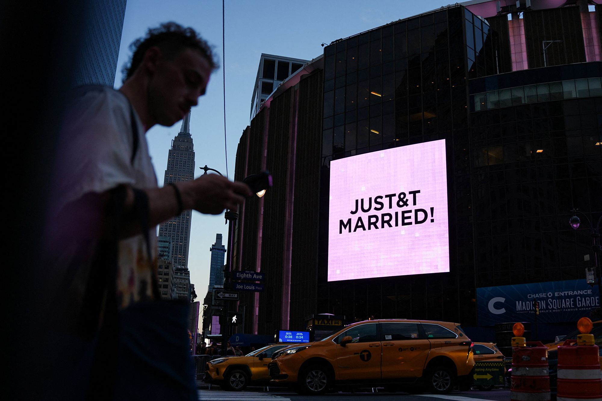 <i>Angelina Katsanis/Reuters via CNN Newsource</i><br/>A screen displays a message referencing Taylor Swift and Travis Kelce outside Madison Square Garden