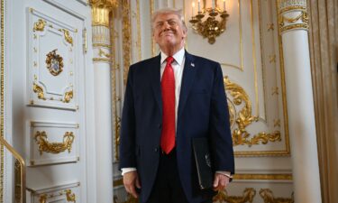 President Donald Trump arrives at the Mar-a-Lago ballroom in January 2026 for a ceremony to honor a road being renamed after him.
