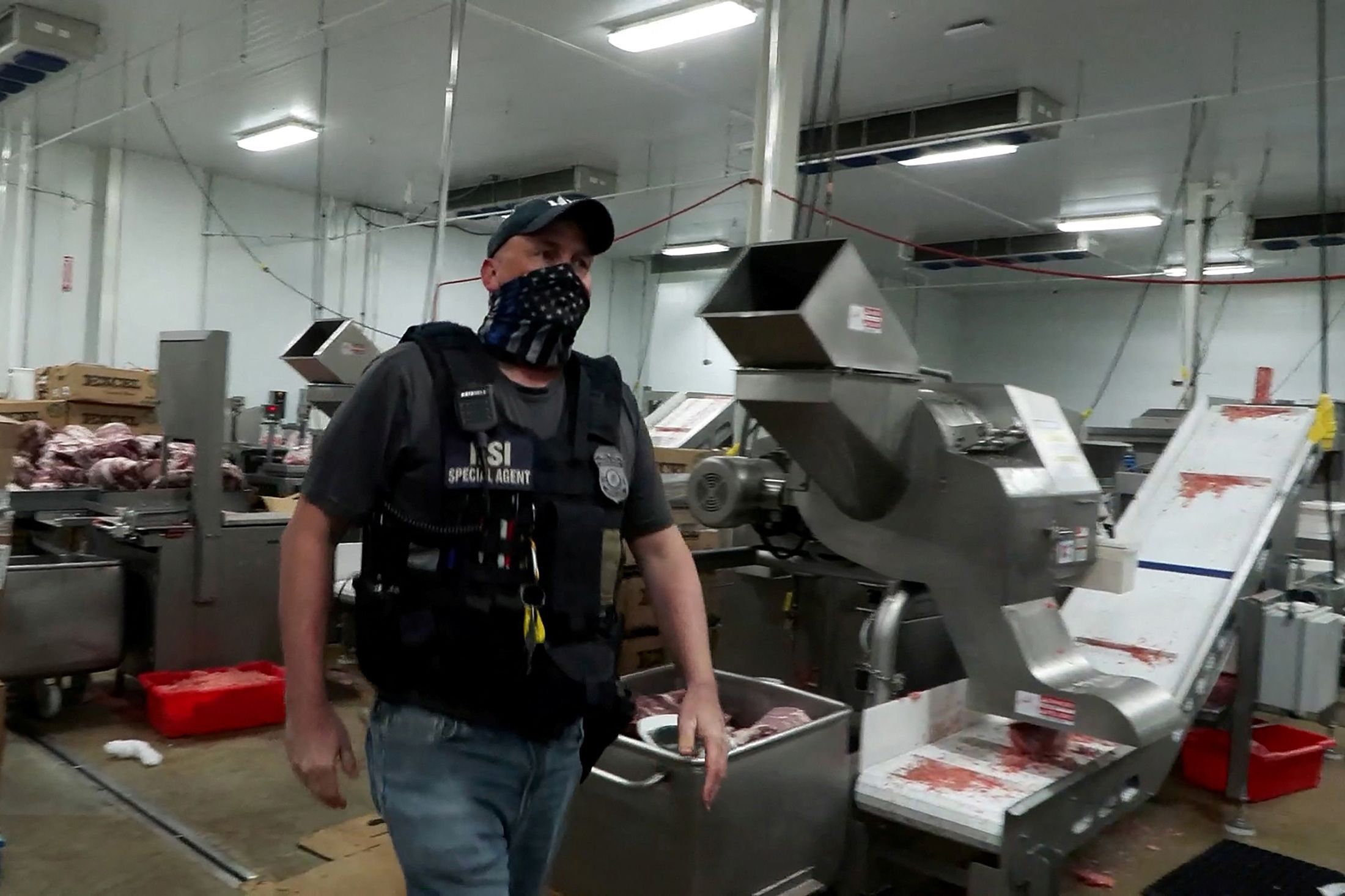 <i>US Immigration and Customs Enforcement/Reuters/File via CNN Newsource</i><br/>A federal agent takes part in an immigration raid at a Glenn Valley Foods meat production plant in Omaha