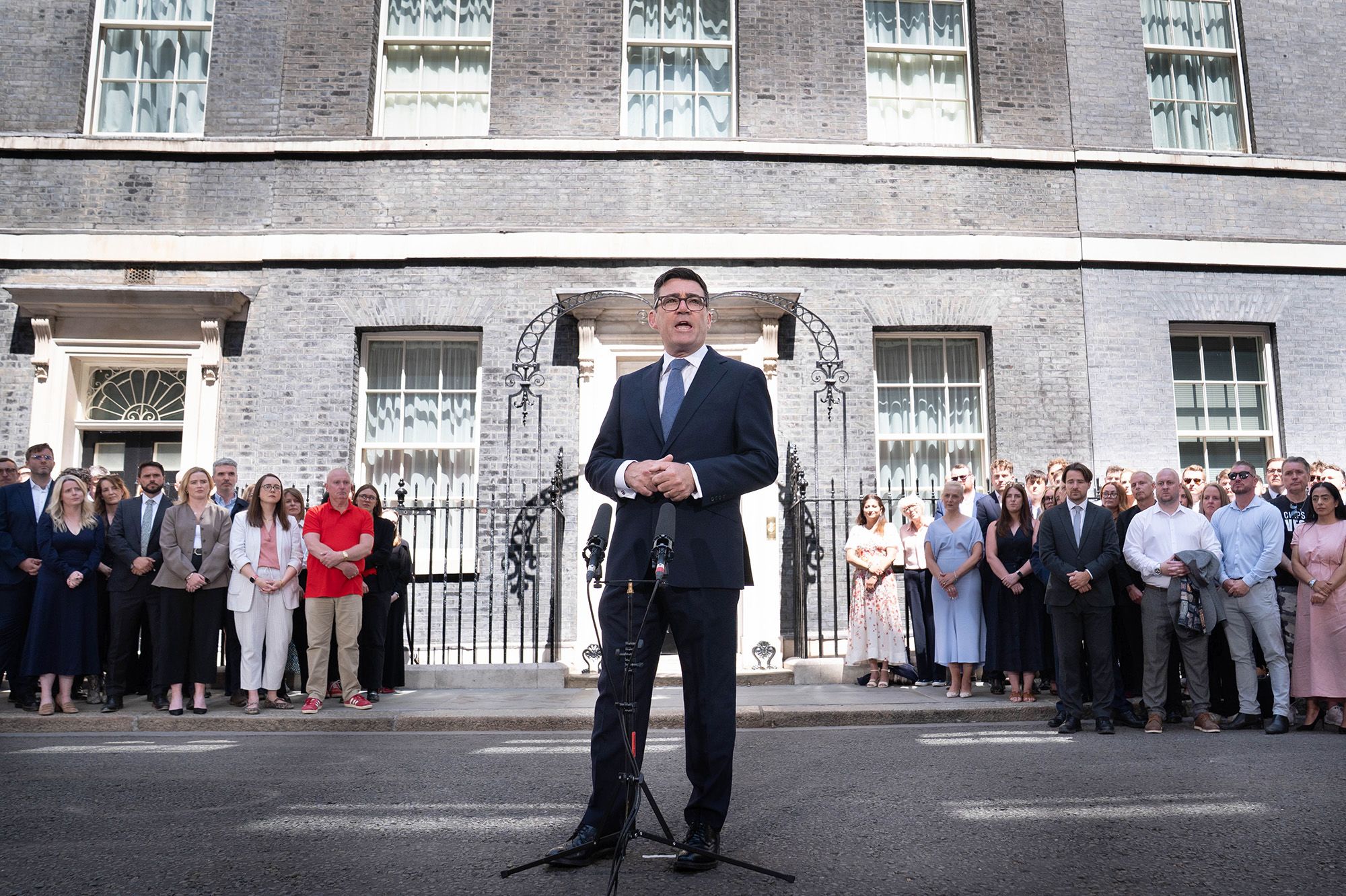 <i>Alberto Pezzali/AP via CNN Newsource</i><br/>Andy Burnham speaks to staff and media outside 10 Downing Street in London on Monday.