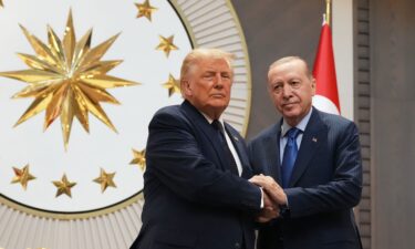 President Donald Trump shakes hands with Turkish President Recep Tayyip Erdogan upon arriving for the NATO summit in Ankara